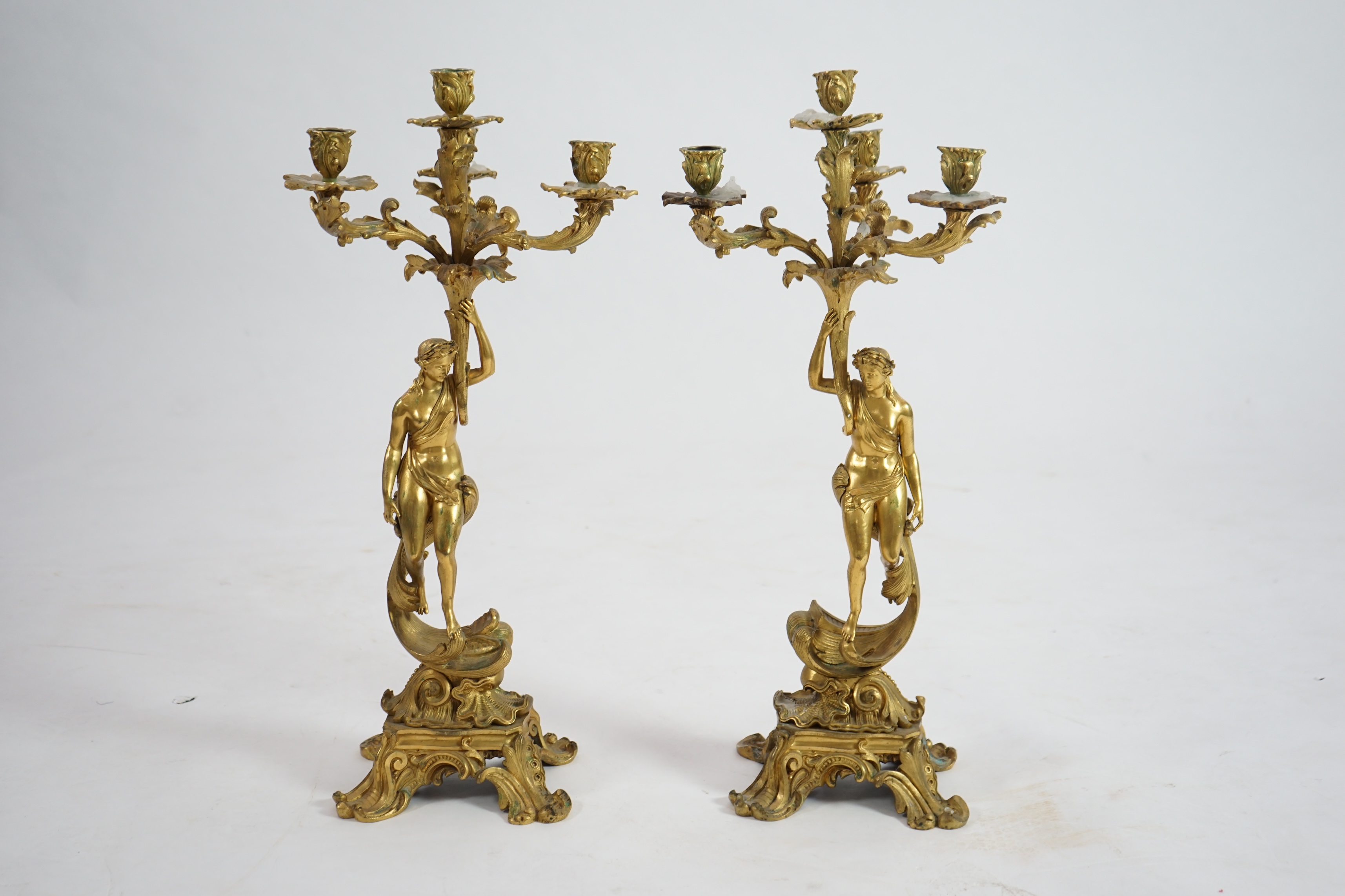 A pair of 19th century French ormolu five light ‘Venus’ figural candelabra